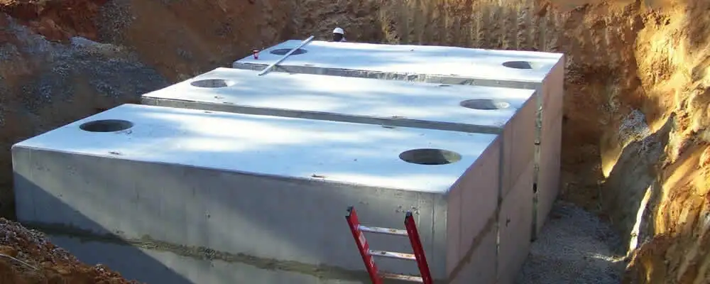 Septic tank installation site with a newly placed concrete tank in Glendale, AZ